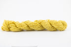 A bright yellow skein of Wensleydale Muga silk naturally dyed with weld.