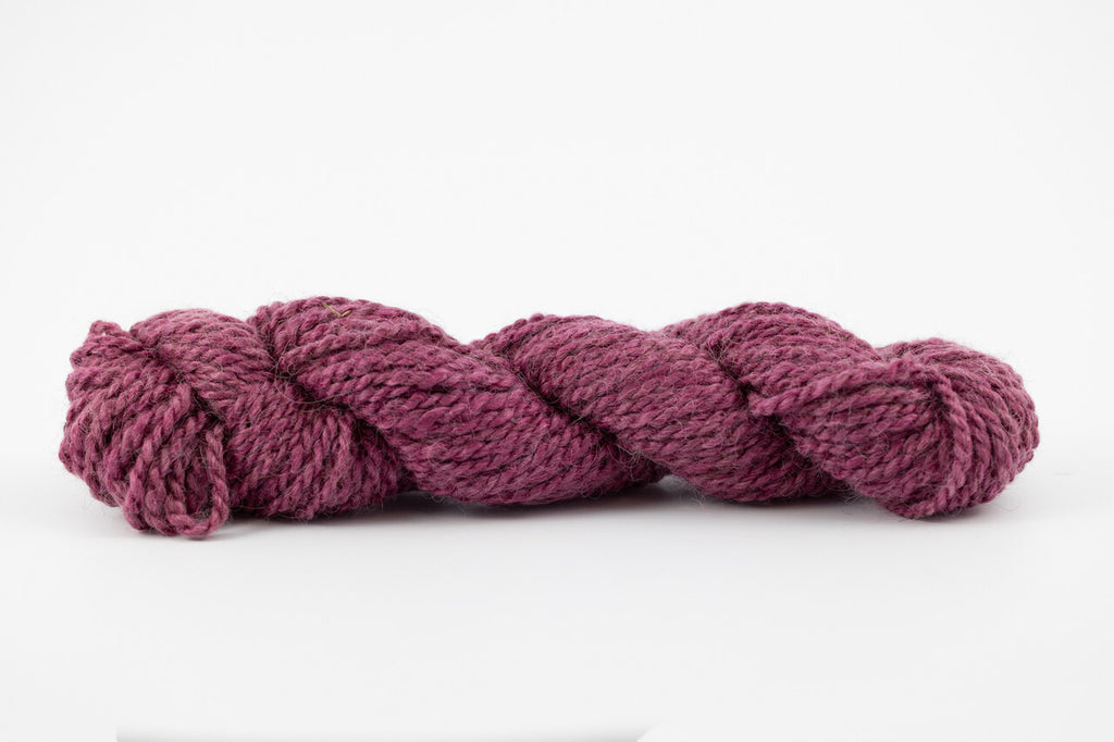 A purple skein of teeswater and muga silk dyed with cochineal.