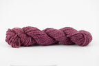 A purple skein of teeswater and muga silk dyed with cochineal.