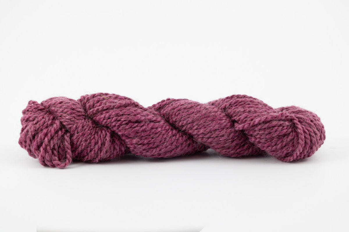 A purple skein of teeswater and muga silk dyed with cochineal.