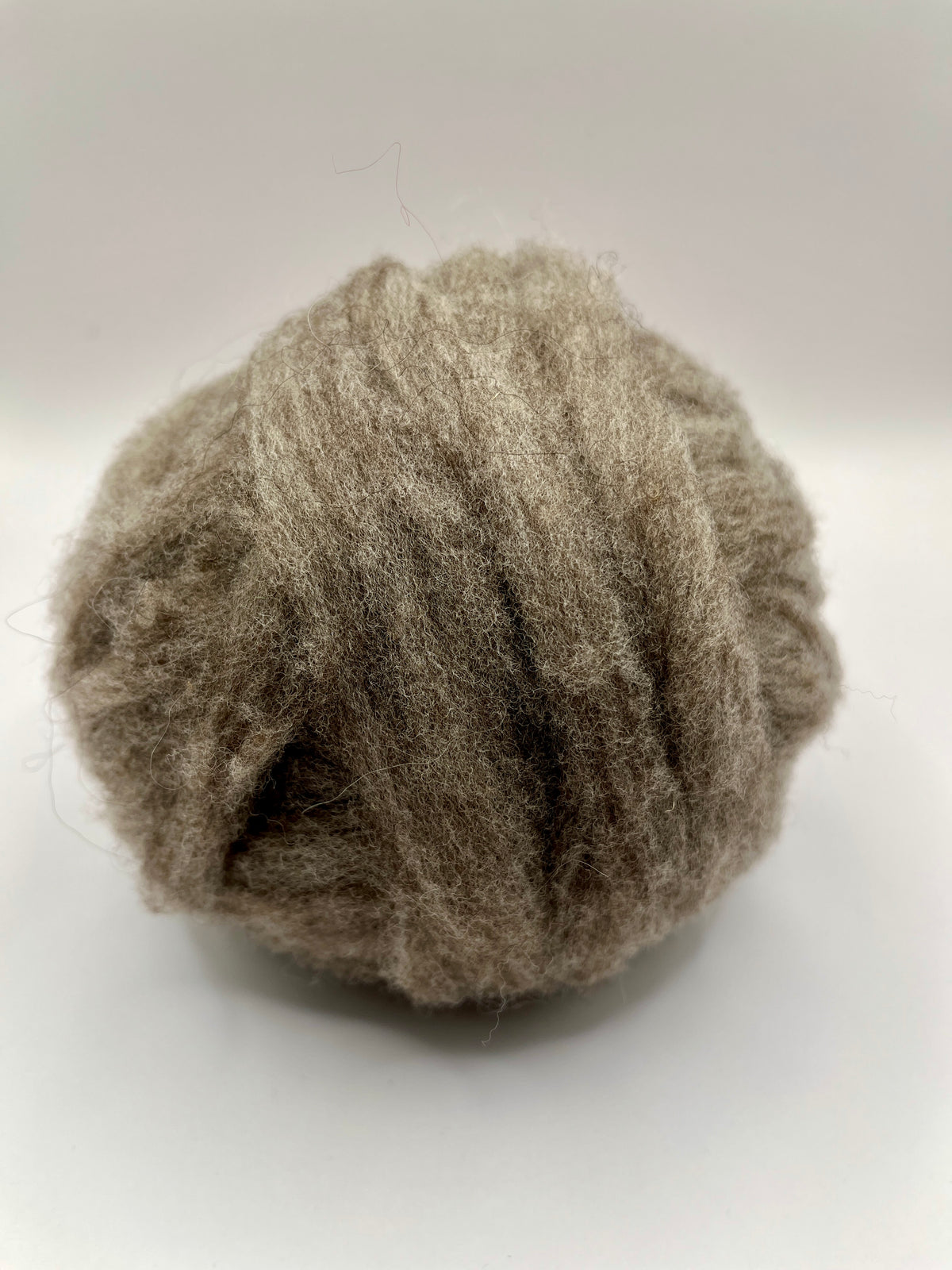 Gray merino roving in a ball
