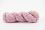 A lavender skein of Shaniko wool and silk yarn naturally dyed with cochineal.